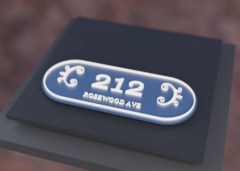 A Capsule Scroll nameplate freshly printed on a 3D printer bed